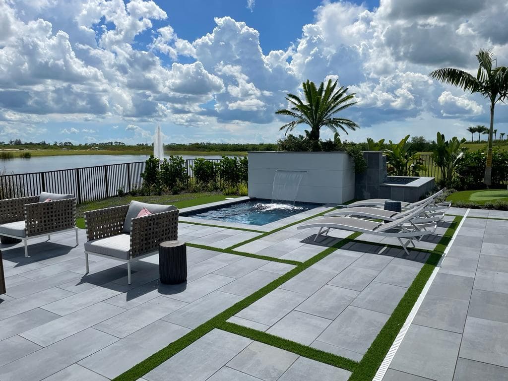 Porcelain paver patio by pool in Florida